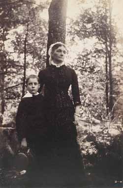 Mrs. Theodore (Mimi) Lyman and `Teddy` (T. L. Jr.) under trees Photograph