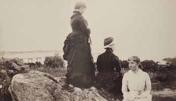 Mrs. Ellerton Pratt, Mrs. George D. Howe, and Alice Pratt on rocks at Smith`s Point Photograph