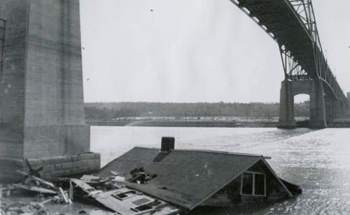 View of a house that floated to the Bourne bridge from Gray Gables, Massachusetts, after the New England Hurricane of 1938 